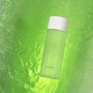 Home A green-tinted bottle floating on a swirling vibrant green liquid background, evoking freshness.