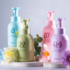 Home A vibrant display of shower gel bottles and flowers for an appealing product shot.